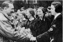 **Hitler with members of his Hitler Youth (left) and League of German Maidens (right)**