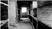 **Image of a brick prisoner barracks in the former Auschwitz-Birkenau camp**