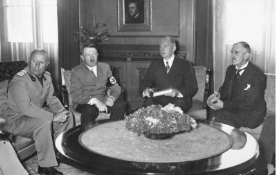 **(From left) Italian leader Benito Mussolini, German Chancellor Adolf Hitler, a German interpreter, and British Prime Minister Neville Chamberlain meeting in Munich, 29 September 1938.**
