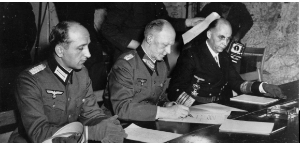 **(from left to right) Wilhelm Oxenius, Gen. Alfred Jodl and Hans-Georg von Friedeburg during the signing of surrender in Reims, France**