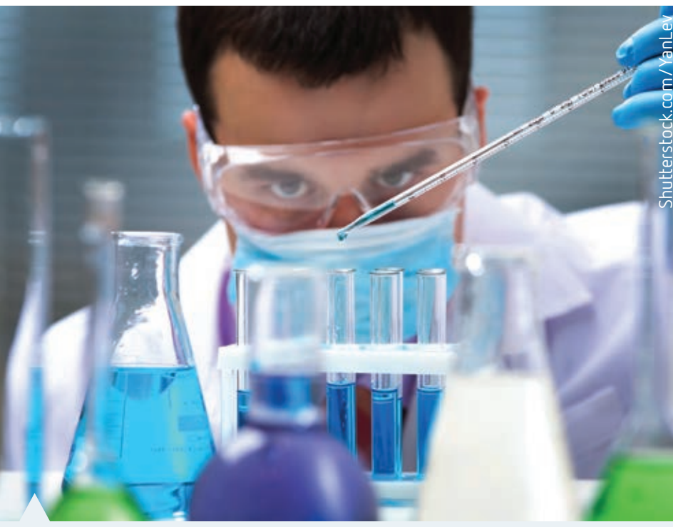 Laboratory setup showing PPE and fume hood use